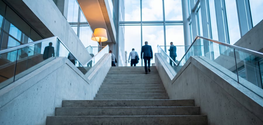 A wide concrete staircase climbing against the sky