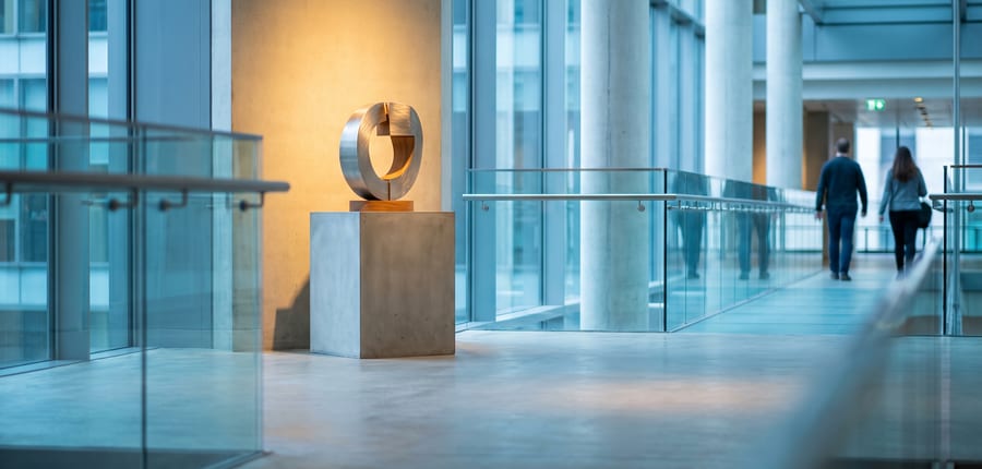 A sculptural object on a plinth in an empty gallery